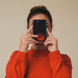 an image of a woman holding her cell phone