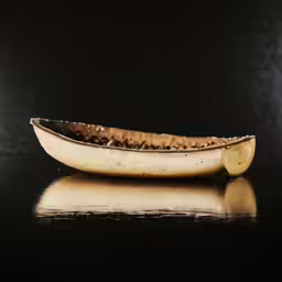 there is an empty canoe that is on the table