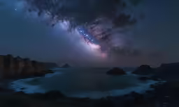 stars shining above a body of water