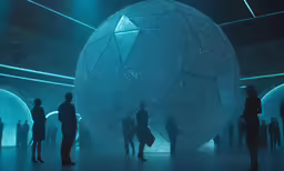 group of people walking by an art installation