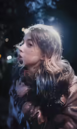 the girl is smoking a cigarette outside