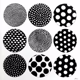 nine black and white polka dot circles,six circles with different dotted dots on the surface