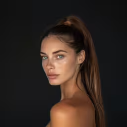 a model is looking straight into the camera,the young girl is posing for the camera