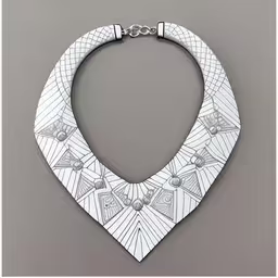 an art piece, the collar of a necklace with an animal head and diamond pattern, on a grey background,a necklace with geometric design and metal bar,this white necklace has a pattern on the neck and a cross in the center,the white, geometric necklace is part of a series of collar pieces with white geometric pattern and silver accents,a white collar necklace is on display against a wall