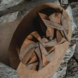 a stone sculpture that is on top of rocks