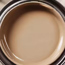 the base of a cup sitting on top of a counter