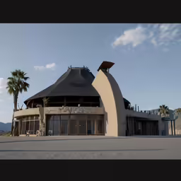 a large building that is sitting in the dirt