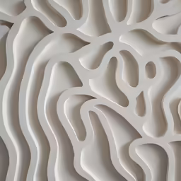 an abstract, white artwork that is made out of concrete