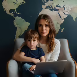 young mother with her little boy using a laptop