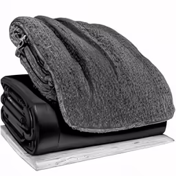 black towels sitting on top of a mat
