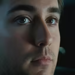 a close up of a man with one eye open
