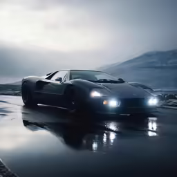 the sports car is driving down a road at night