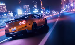 a yellow car drives down a city street at night