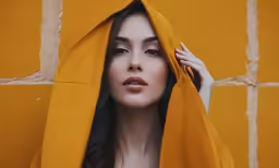 the girl is covered up in yellow clothes