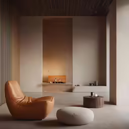 an elegant chair is next to a candle lite