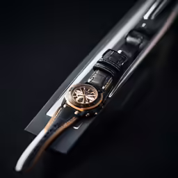 watch resting on the side of the watch band
