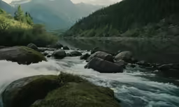 the creek is running past many mountains and forests