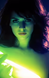 a woman is staring ahead with light shining behind her