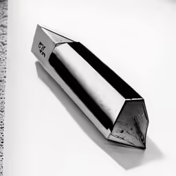 a silver box is on a white table