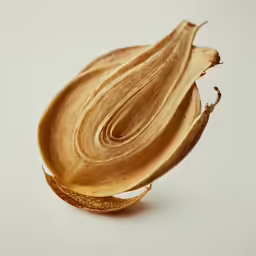 a pile of sliced up onions on a white surface