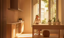 a woman sitting at a desk in front of a window