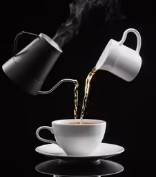 a steaming cup that has some liquid in it