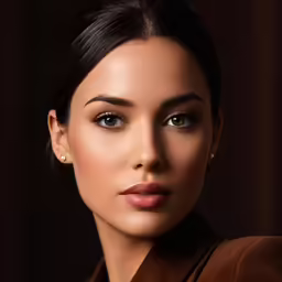 a beautiful woman is wearing a brown shirt