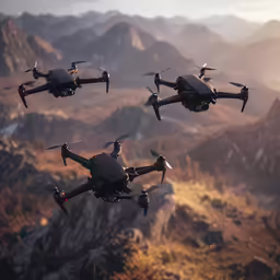 three large grey and black flying planes with mountains in the background
