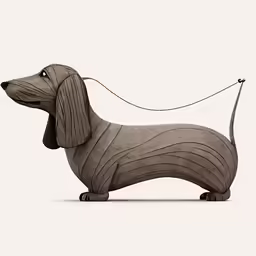 the dachshund dog is standing next to a wire