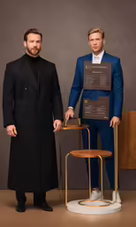 two men wearing blue suits stand next to one another