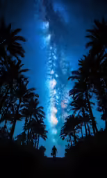 two people are standing under the stars of the milky