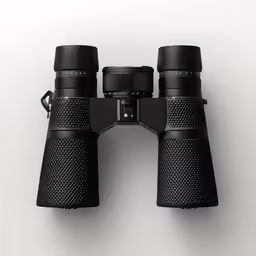 a pair of binoculars sitting side by side