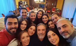 a group of smiling friends taking a selfie