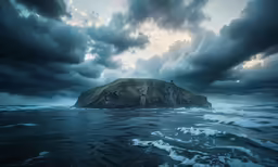 a lighthouse on top of an island in the ocean