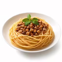 an overhead view of pasta with nuts and basil on a white background
