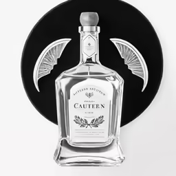 a bottle of alcohol sits on a circular object
