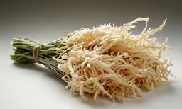 a bunch of alfalfa laying on top of a table