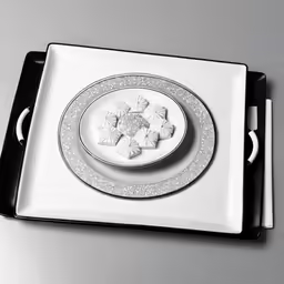 a tray with a white and black plate