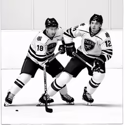 the two young hockey players are competing for control