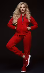 a beautiful blond woman wearing a red sports suit