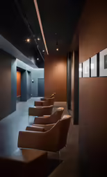 a row of brown chairs sitting in the corner of a room