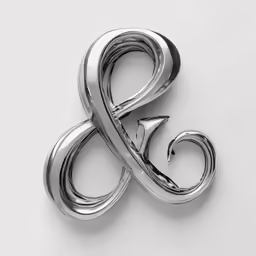 a silver letter with a swirl on it