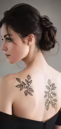 a woman with very pretty tattoos on her back
