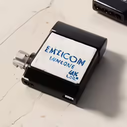 a close up of a electronic device with the text emmicon unifying