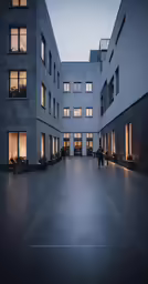 two long, empty courtyard with people standing outside