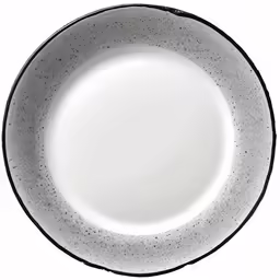 a white and black plate with dots in the center