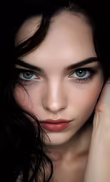 a woman with blue eyes poses for the camera