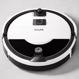 a robotic vacuum is being used on the surface