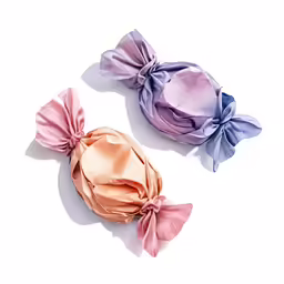 two pink and a blue satine bow hair ties