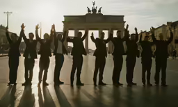 some people are standing in front of a monument